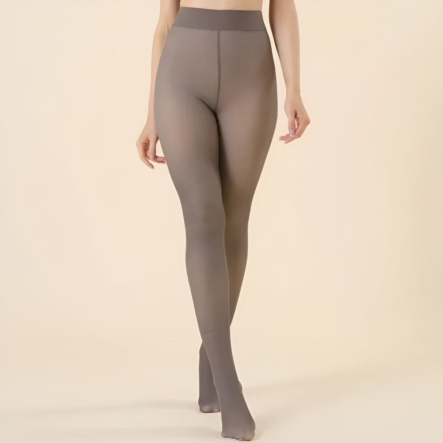 Gray tights worn by a person on a beige background