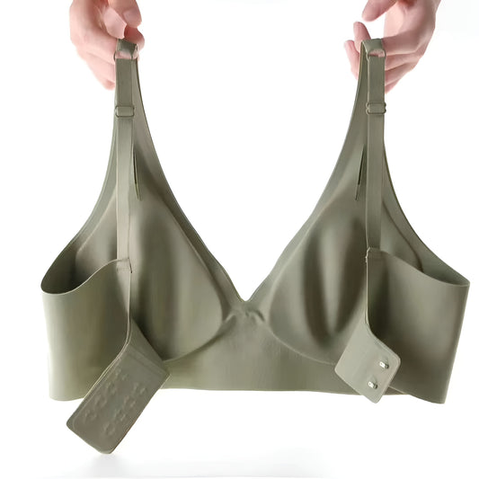 Green bra held up by hands on a white background